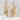 Dragon Ear Climber Earring, gold vermeil, pair shown on stone pedestal