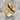 Bursting Coffin Ring, gold vermeil, product photo on stone