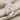 Web Dome Ring in polished silver, angled view on fabric