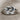 Infinity Knot Loop Ring, oxidized silver, front view on linen