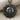 Celestial Sun Face Pendant, black rhodium, front view on fabric