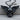 Outspread Winged Skull Pendant, black rhodium, front view on wood base