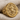 Saint Rose of Lima Ring, gold vermeil, angled front view on fabric