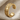 Urartu Griffin Ear Cuff Earring, gold vermeil, side view on fabric