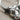 Hittite Bull Earring, oxidized silver, close-up of facial features and horn detail