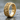 Rose Vine Skull Ring, gold vermeil, angled view on wet stone