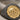 Caesar elephant coin ring, two-tone finish, angled close-up of elephant coin relief