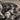 Squirrel and Pine Cone Pendant, oxidized, close-up of squirrel and pine cone relief