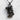 Rescue Combat Medic Pendant, black rhodium, front view on textured surface