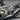 Sport motorcycle pendant, oxidized silver, close-up of exhaust and engine