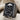 Crossed Axes Skull Ring, black rhodium, angled view on fabric