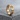 Love Wins Ring, gold vermeil, angled view on stone base