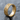 Love Is Love Ring in gold vermeil finish, angled view on natural rock