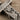 Göbeklitepe Pillar Pendant, close-up of carved fox and crane relief