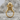 Atlas Globe Ring, gold vermeil, front view on stone surface