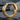 Triple Groove Industrial Hoop Earring, gold vermeil, product photo on stone