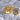 Bear Paw Shield Lapel Pin, gold vermeil, product photo on stone surface