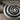 Conch spiral shell earring, oxidized silver, close-up view of the spiral relief