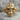 Biomechanical Spine Skull Ring, gold vermeil, front view on stone surface