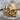 Baroque Horned Skull Ring, gold vermeil, product photo on stone base