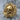 Shard Skull Ring, gold vermeil, angled view on stone surface
