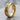 Arrow Spinner Ring, gold vermeil, angled view on stone surface