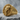 Cyber skull ring in gold vermeil on stone surface