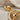 North Star Planet Earring, gold vermeil, close-up of star and planetary rings
