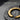 Zen Enso Circle Pendant, close-up of brushstroke texture and hammered disc