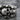 Catacomb Skull Hoop Earring, oxidized silver, close-up of skull cluster details