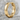 Notched Industrial Hoop Earring, gold vermeil, angled product photo on stone