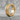 Segmented Industrial Hoop Earring, gold vermeil, front view on stone