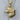 Fox Head Pendant, gold vermeil, side profile view on wood