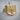 Albanian Eagle Ring, gold vermeil, angled product view on wood