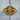 Winged Masonic Skull Ring, gold vermeil, front view on wood surface