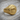 Reptilian Eye Ring, gold vermeil, angled view on weathered wood