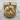 Coiled Tiger Pendant, gold vermeil, product photo on wood surface