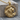 Circle Frame Lion Pendant, gold vermeil, product photo on wood block