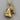 Bridled Horse Head Pendant, gold vermeil, product photo on wood surface