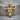 Charging Bull Pendant, gold vermeil, front view on wood base