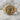 Alexander the Great Ring, gold vermeil, product photo on stone surface
