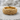 Woven rock ring, gold vermeil, product photo on stone