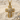Ribbon cross pendant, gold vermeil, product photo on sand