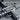Submachine Gun Pendant, oxidized, close-up of receiver details