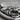 Square Lion Pendant, oxidized silver, close-up view of carved lion mane and face