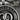 Alpha Omega Verse Pendant, oxidized silver, close-up of sunburst and letters