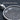 Lord's Prayer Disc Pendant, oxidized, angled close-up of the raised text and cross