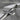 Plain Beveled Latin Cross Pendant, oxidized silver, angled close-up view