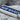 Ave Maria Letter Bar Pendant, oxidized, close-up showing blue enamel and lettering