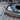Evil Eye Crescent Halo Pendant, oxidized silver, close-up of realistic eye and stone details